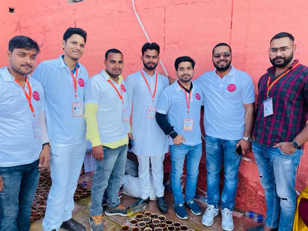 Ayushman Foundation volunteer team in matching uniforms standing together at a community event